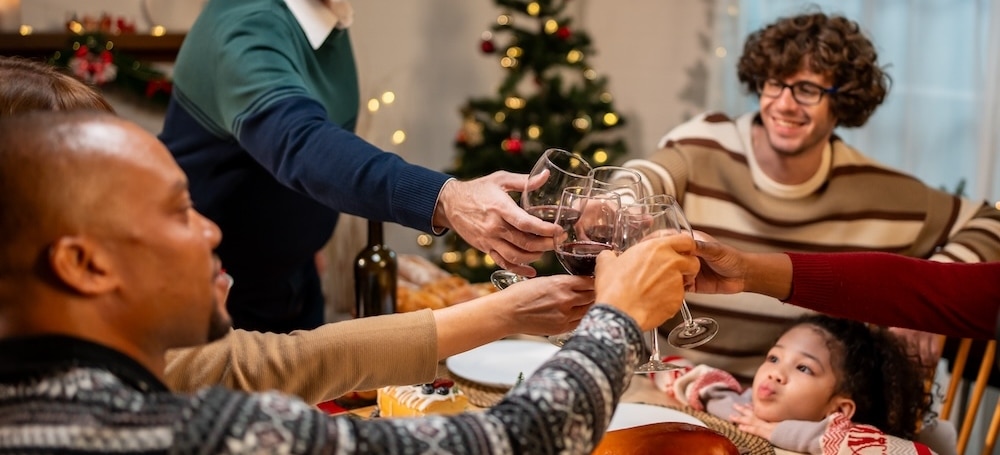 Family celebrating Christmas over dinner